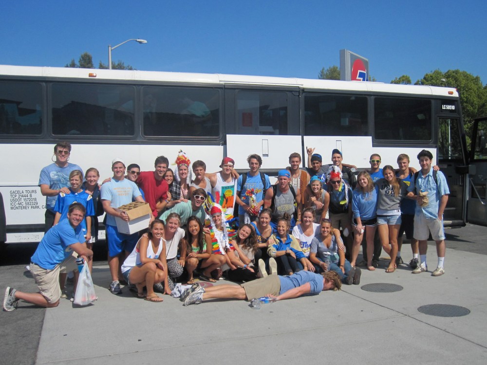 Maddy and friends in front of chartered bus----Photo Credit: Maddy Grubman