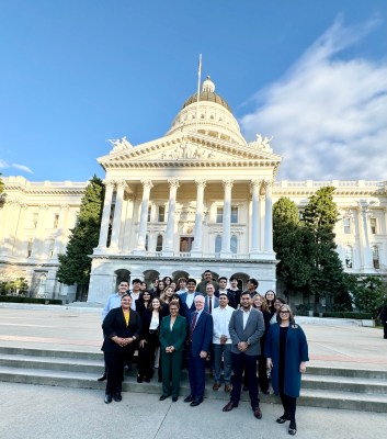 Group photo of Satema and her peers outside of the California State Capitol with the Mayor of Los Angeles. 