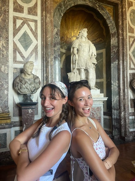 Maya with a friend inside the Palace of Versailles.