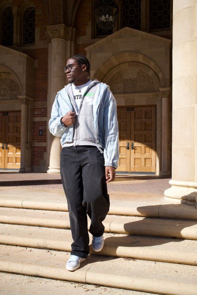 Divine walking down the steps in front of Royce Hall at UCLA.