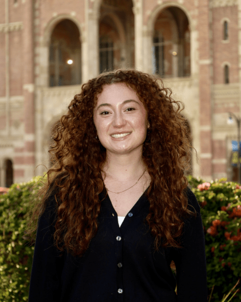 Professional photo of Mikayla in front of Royce Hall. 