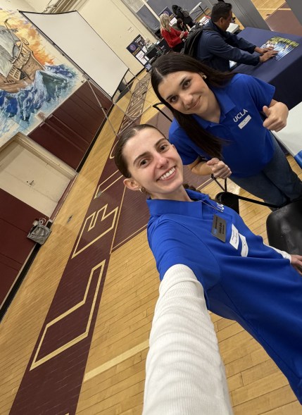 Selfie of Camila with a fellow Bruin Ambassador at a college fair.