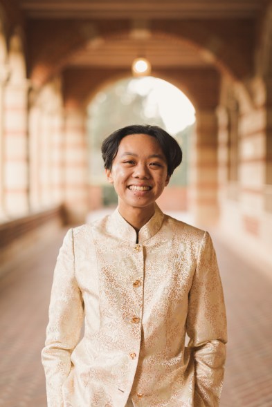 Professional photo of Bruin Blog writer, River, standing outside Royce Hall at UCLA. 